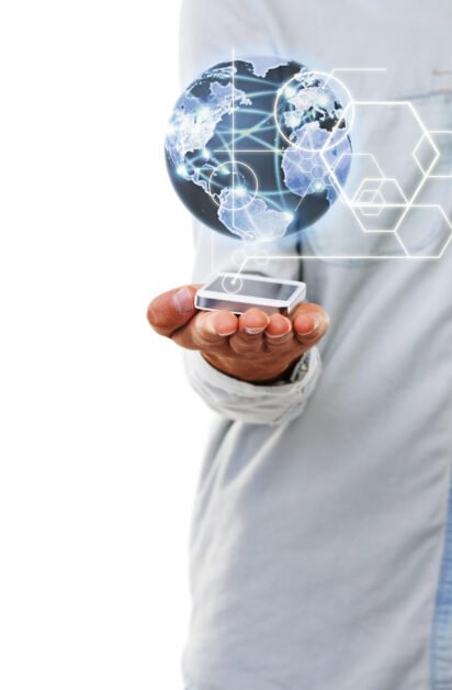 Global power. A close up of a mans hand holding a digital world globe with a white background