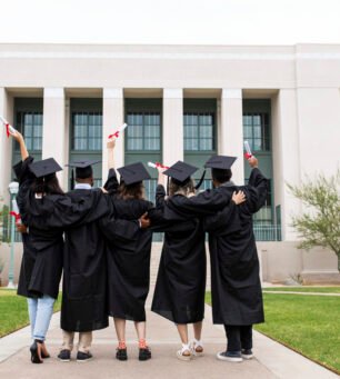 University students in graduation gowns